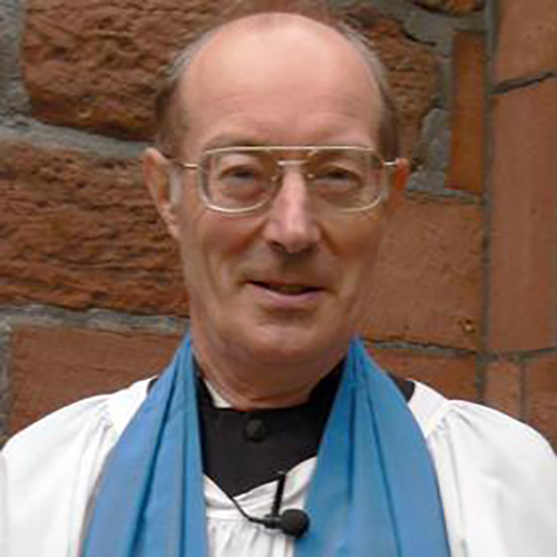 Reader John Smith, stood outside church