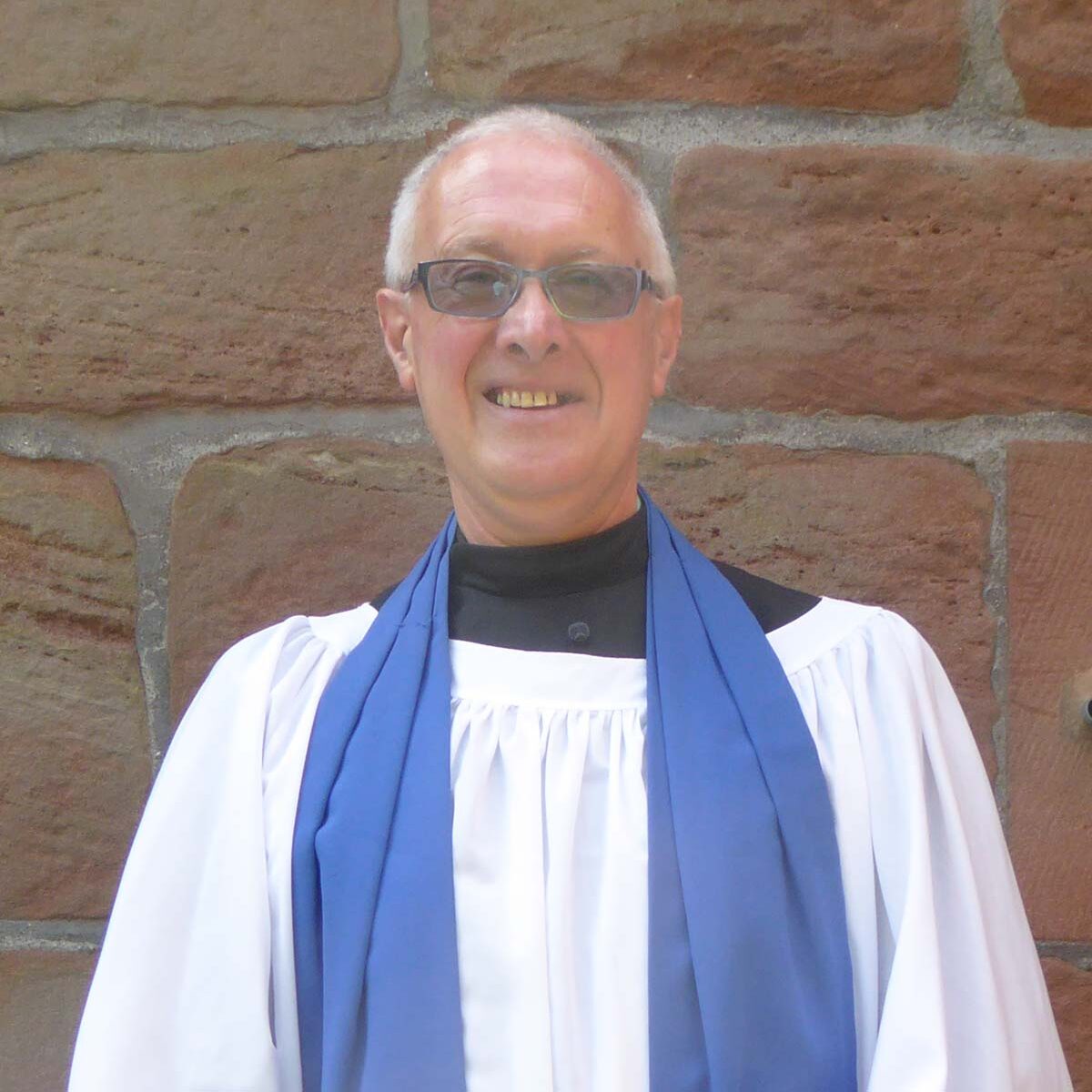 Reader Graham Crowder, stood outside church