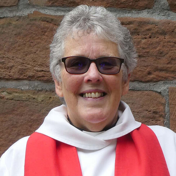 Reverend Mary Railton-Crowder, stood outside church